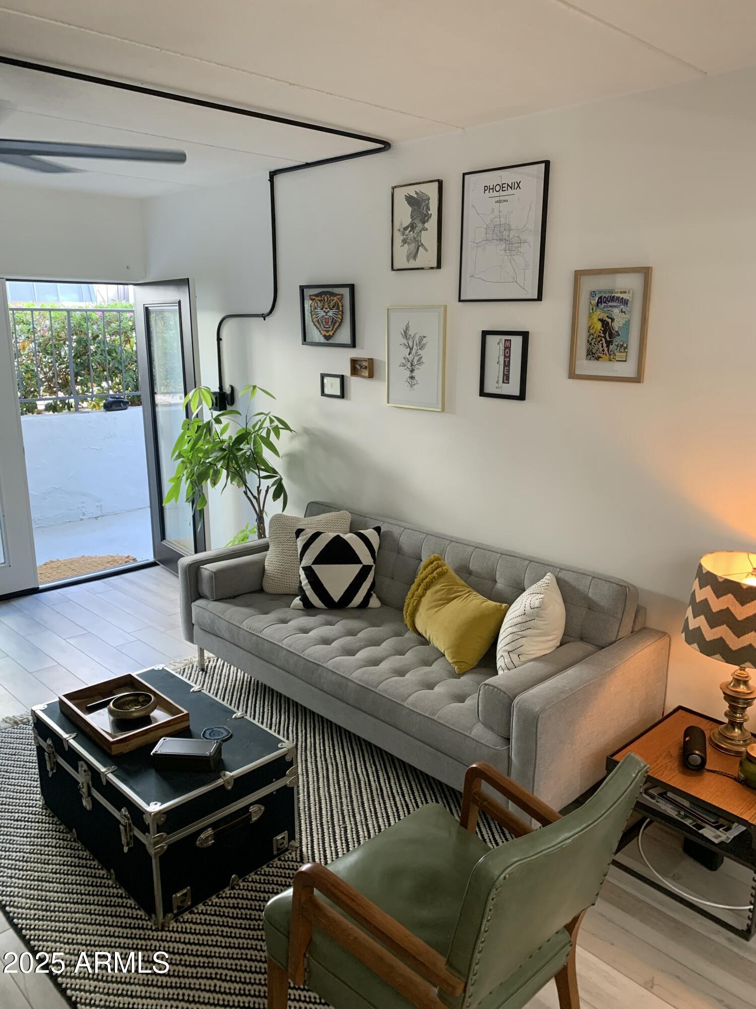 3416 North 44th Street, Unit 34 Phoenix, AZ 85018 - Photo 31 of 41 a living room with furniture and a window
