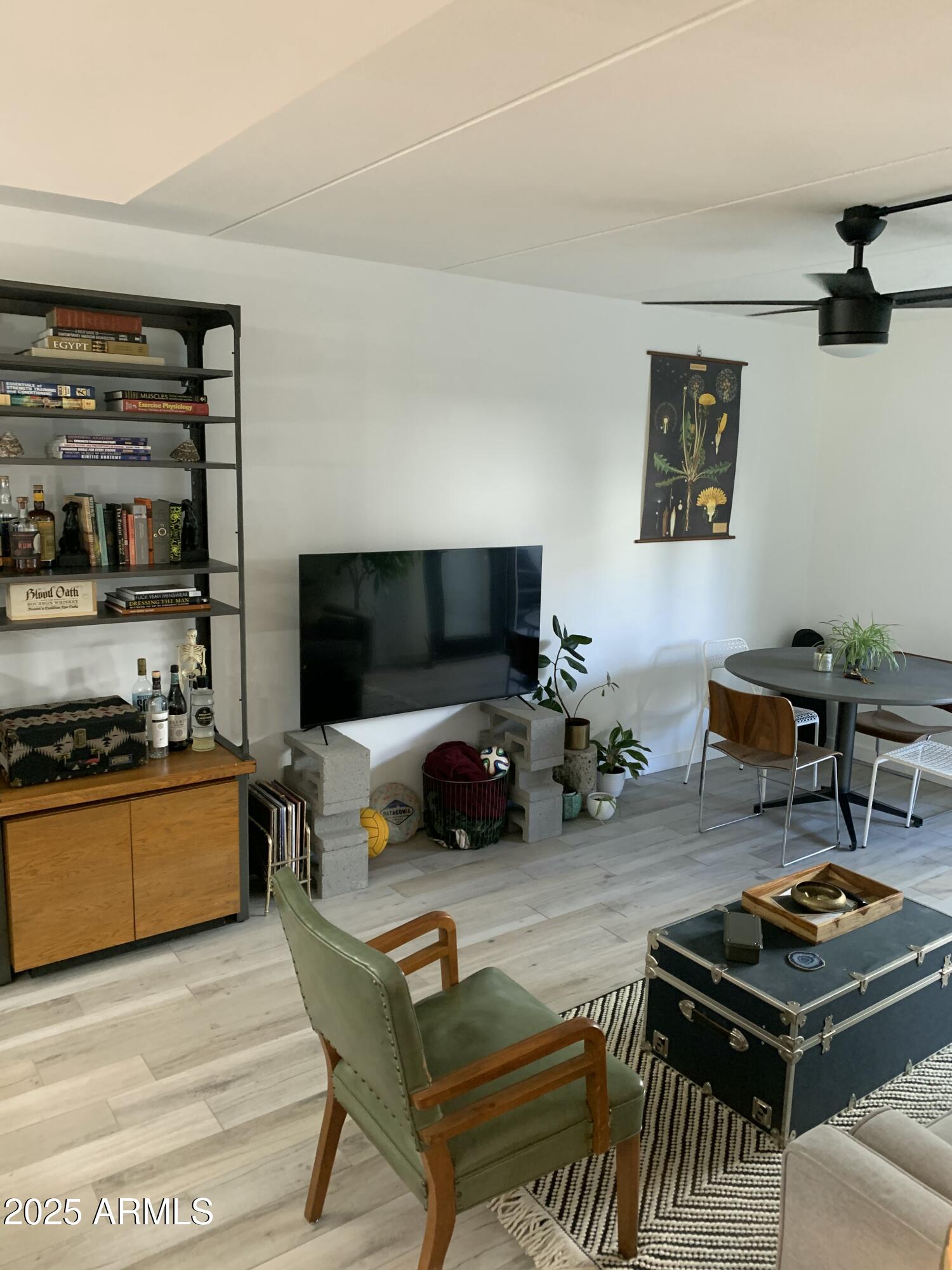 3416 North 44th Street, Unit 34 Phoenix, AZ 85018 - Photo 32 of 41 a living room with furniture and a flat screen tv