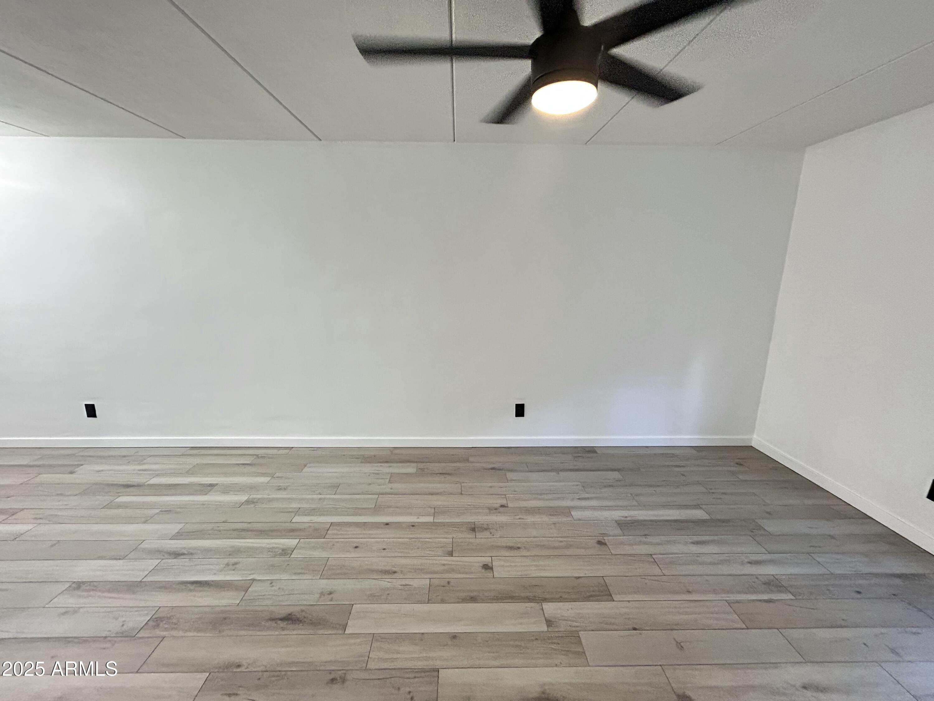 3416 North 44th Street, Unit 34 Phoenix, AZ 85018 - Photo 37 of 41 a view of a room with wooden floor