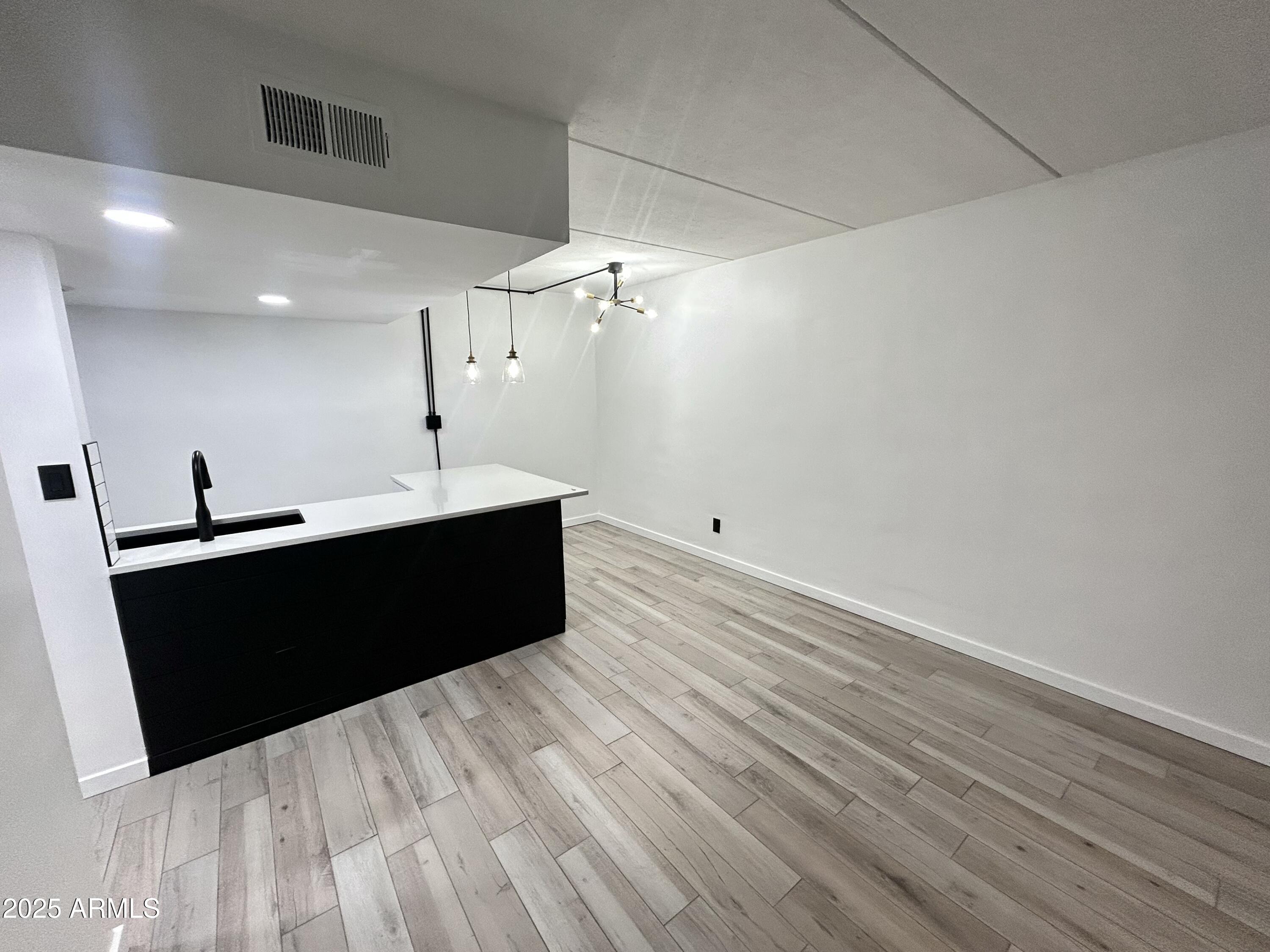 3416 North 44th Street, Unit 34 Phoenix, AZ 85018 - Photo 39 of 41 a living room with a black white checkered floor
