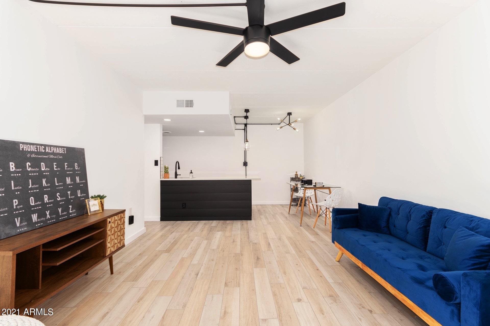 3416 North 44th Street, Unit 34 Phoenix, AZ 85018 - Photo 4 of 41 a living room with furniture