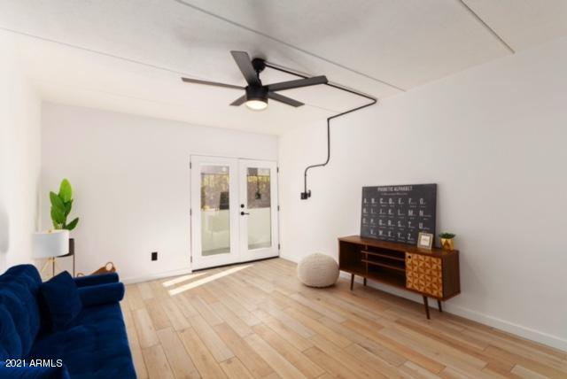 3416 North 44th Street, Unit 34 Phoenix, AZ 85018 - Photo 6 of 41 a living room with furniture and a potted plant