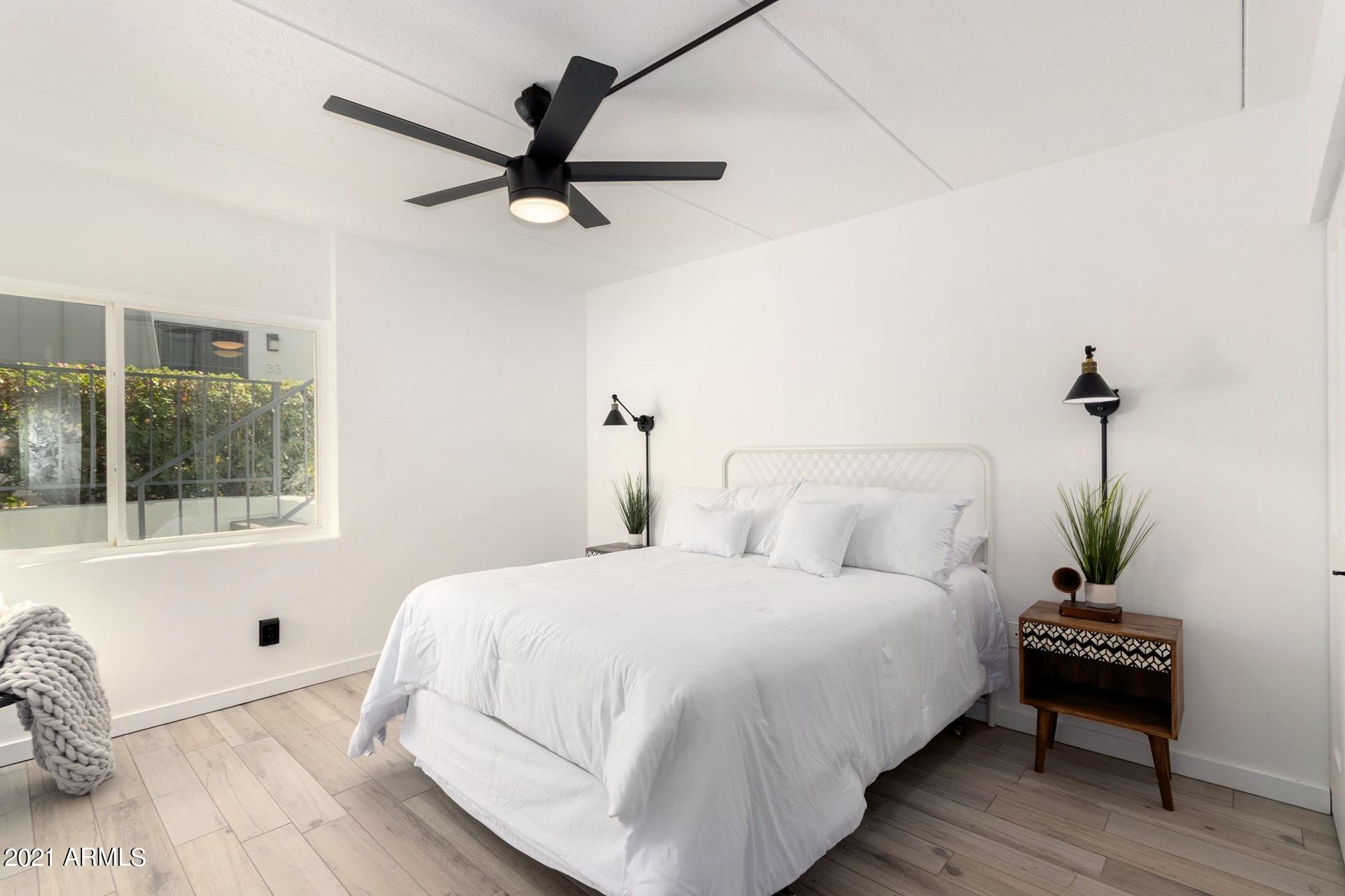 3416 North 44th Street, Unit 34 Phoenix, AZ 85018 - Photo 9 of 41 a bedroom with a bed and a potted plant