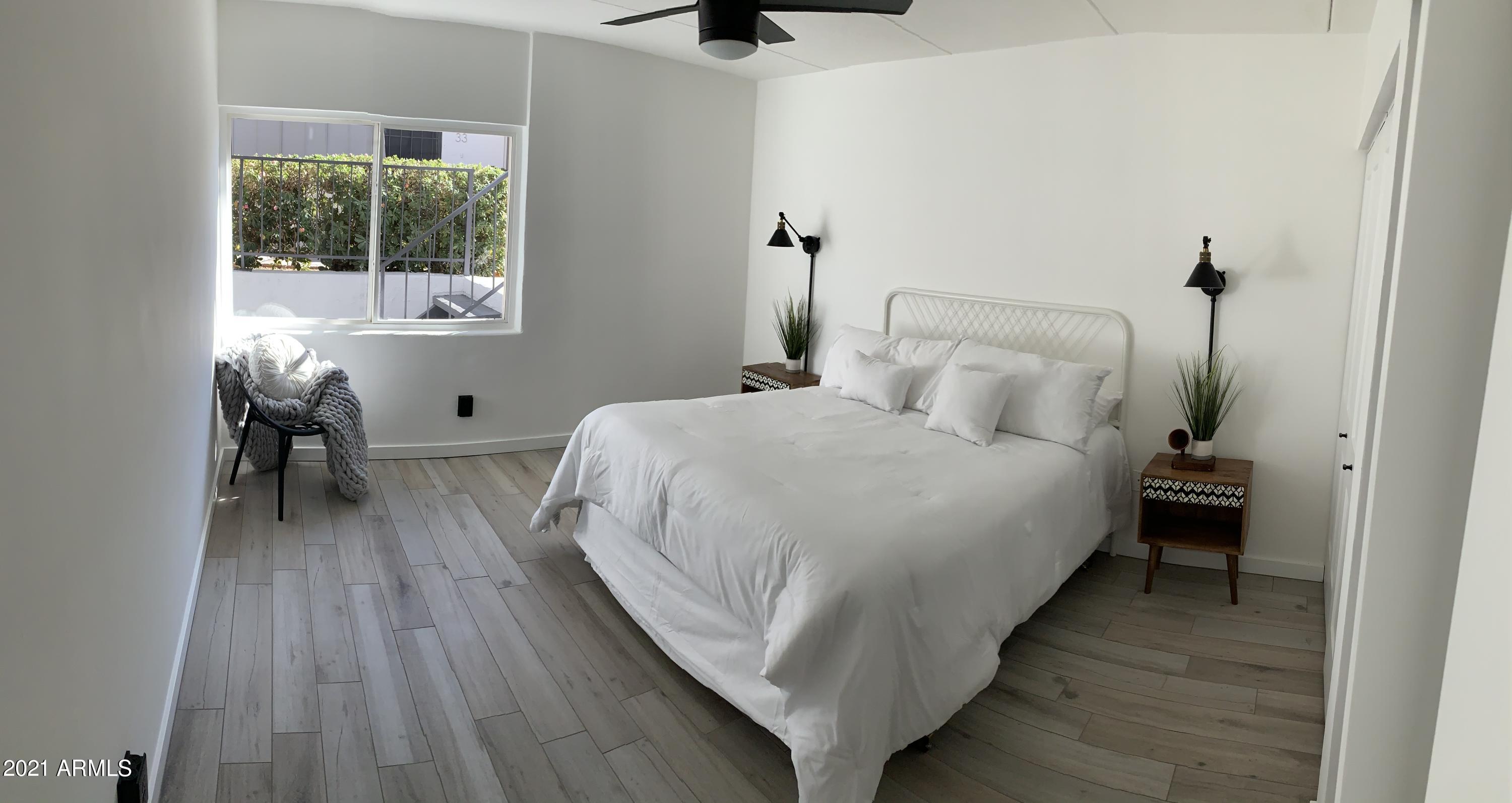 3416 North 44th Street, Unit 34 Phoenix, AZ 85018 - Photo 10 of 41 a bed room with a bed and a chair