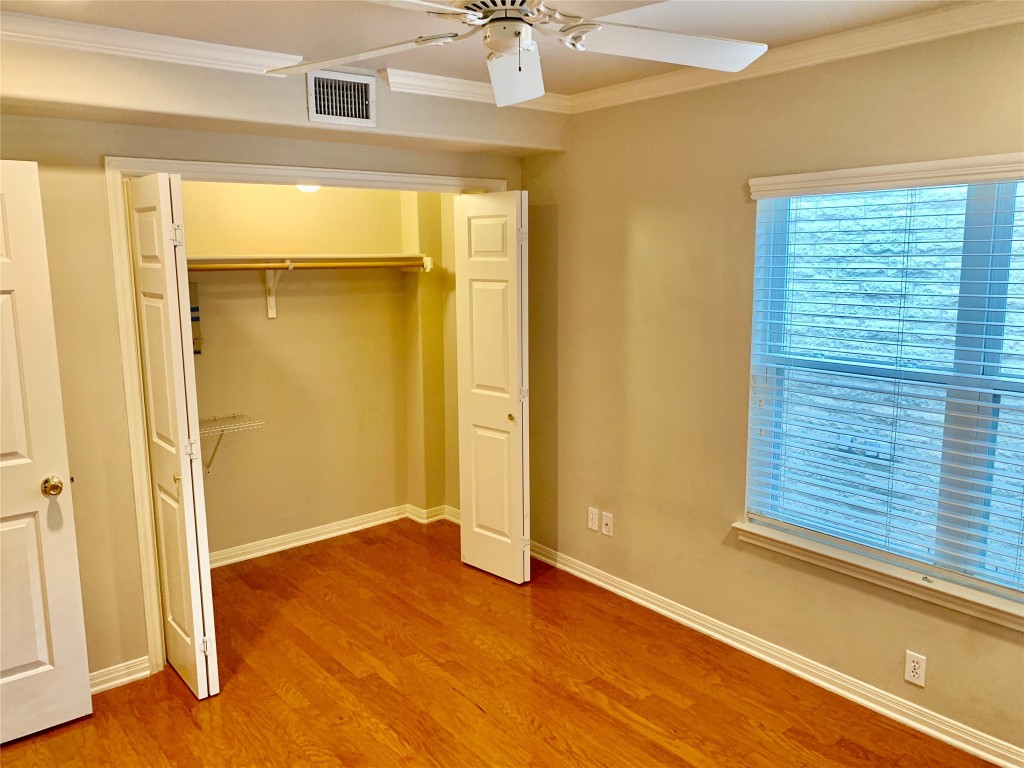 3009 Speedway, Unit 4 Austin, TX 78705 - Photo 12 of 15 a view of empty room with wooden floor and fan