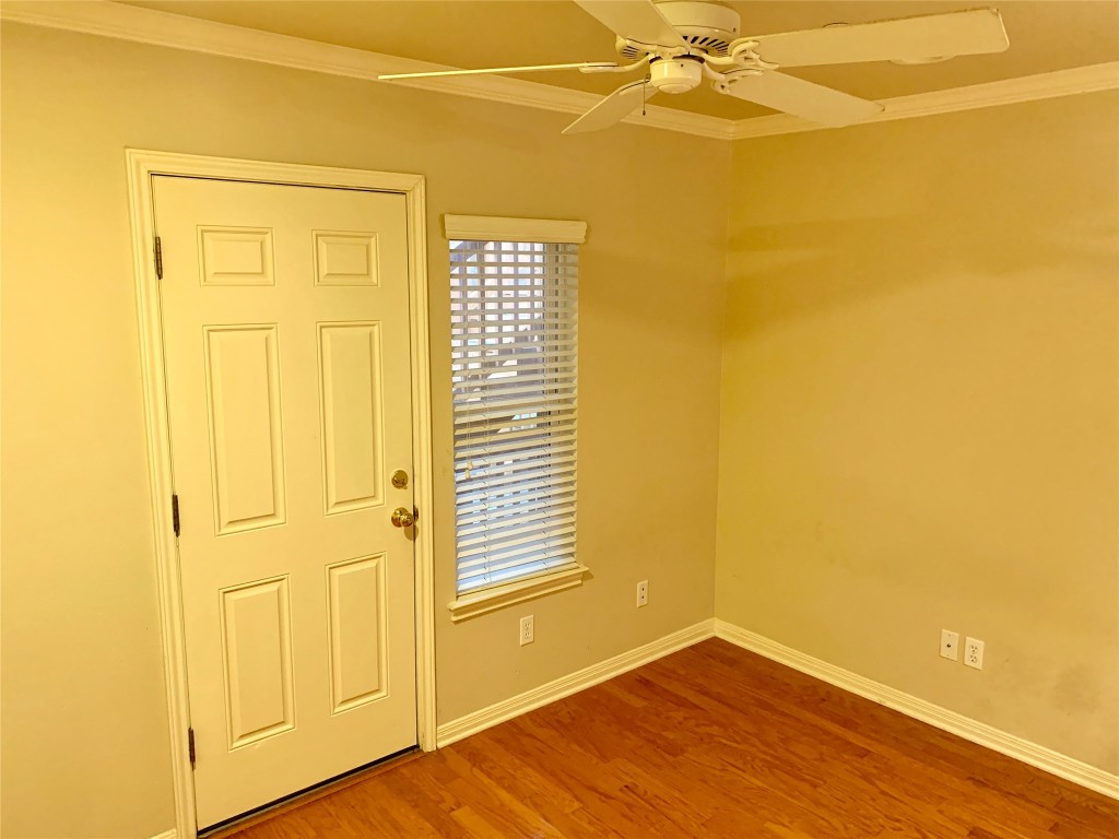 3009 Speedway, Unit 4 Austin, TX 78705 - Photo 14 of 15 a view of a room with a wooden floor and a window