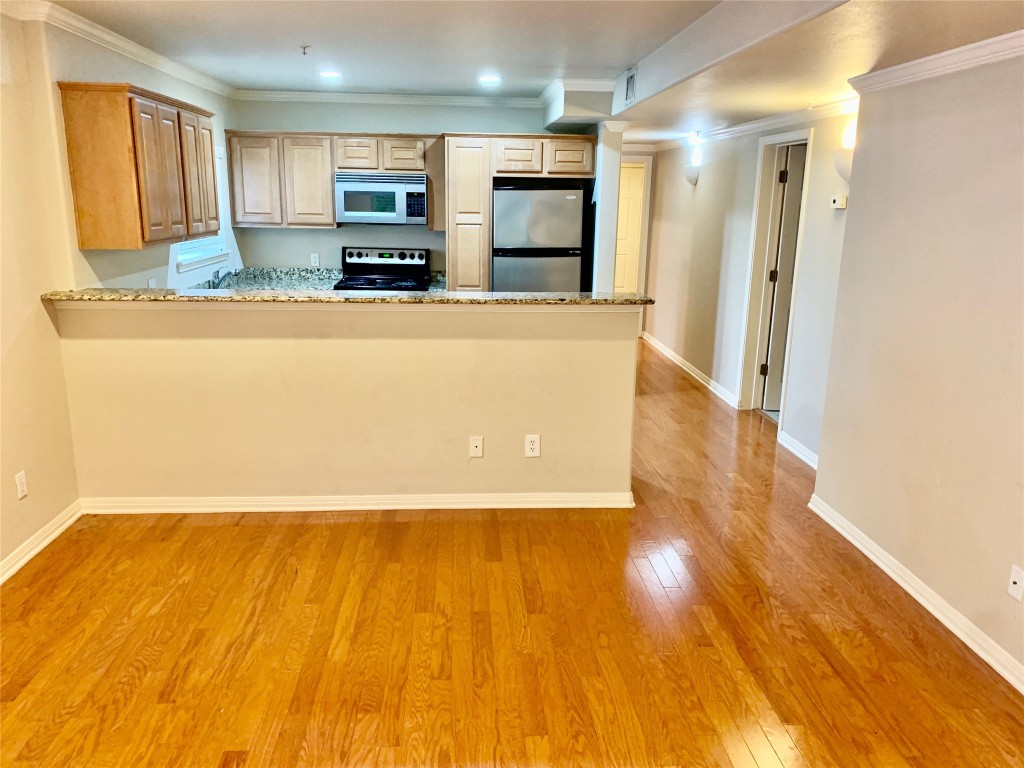 3009 Speedway, Unit 4 Austin, TX 78705 - Photo 3 of 15 a view of kitchen and wooden floor