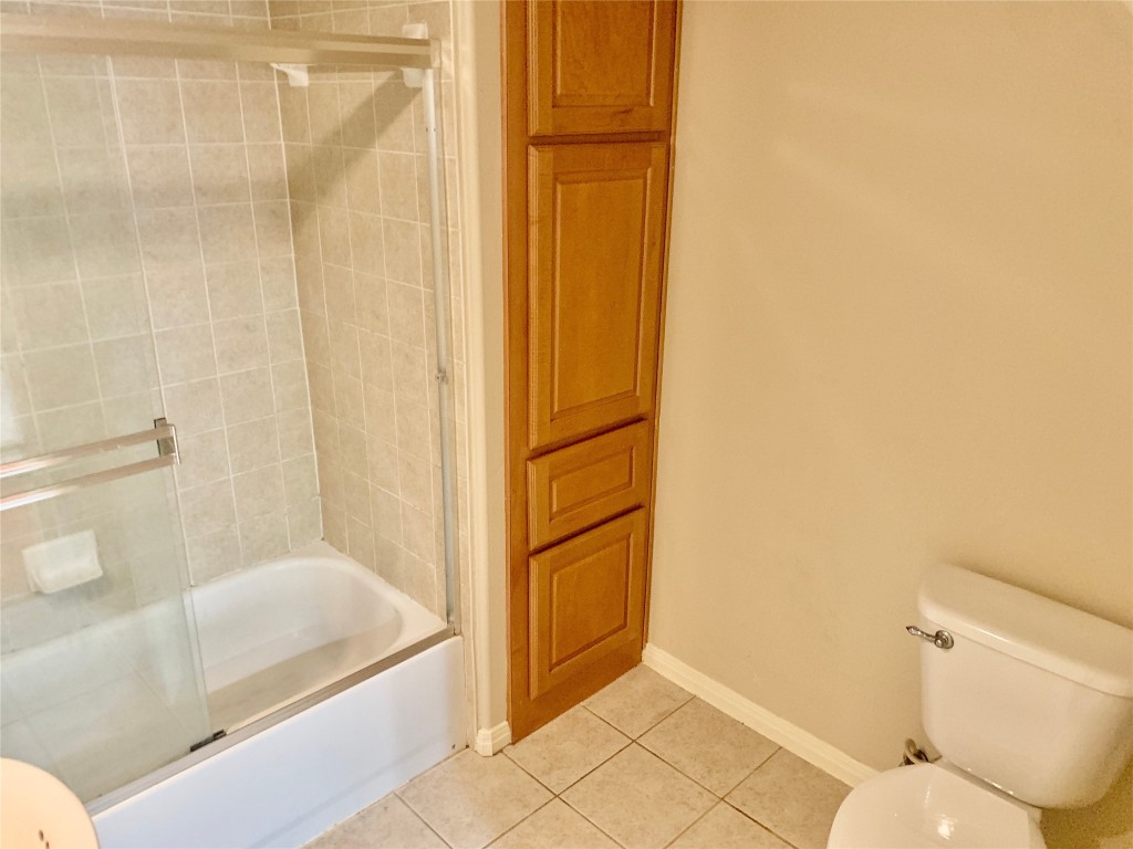 3009 Speedway, Unit 4 Austin, TX 78705 - Photo 7 of 15 a bathroom with a bathtub and a shower