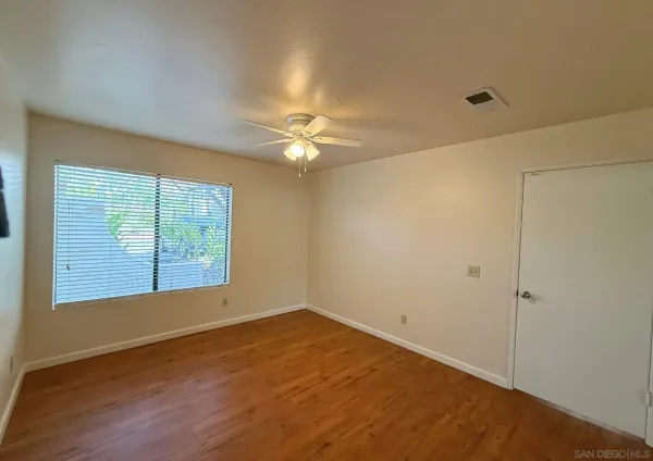 a view of an empty room with a window