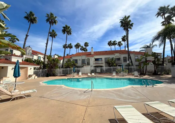 a view of a patio with a table and chairs