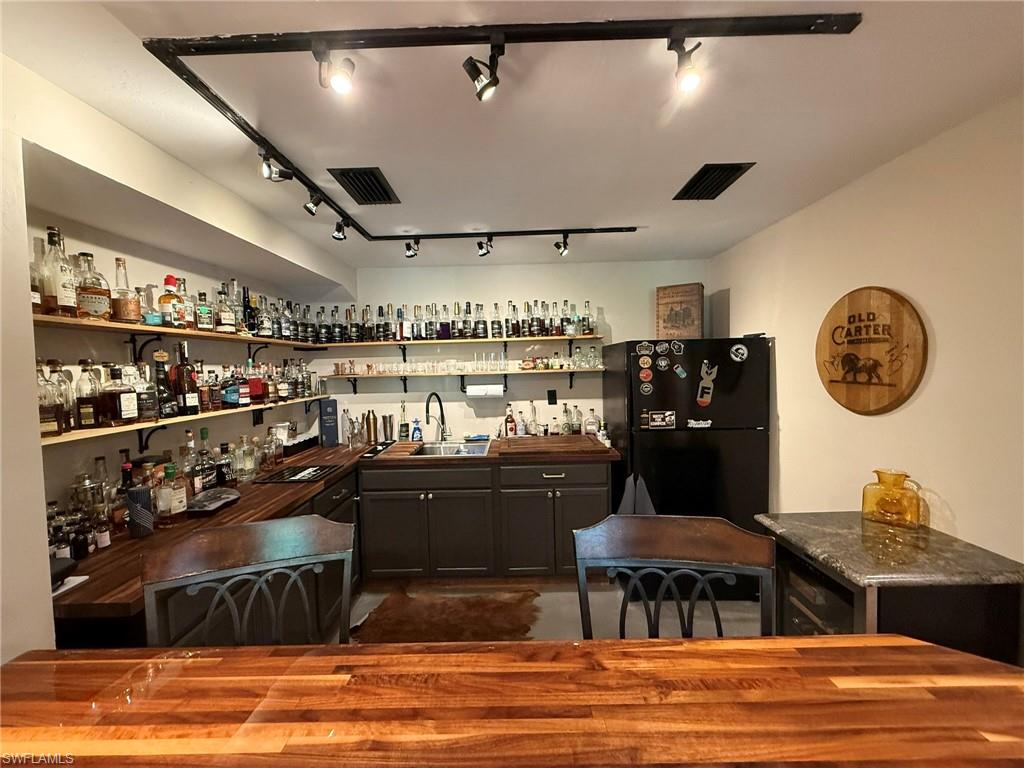 5546 Park Road Fort Myers, FL 33908 - Photo 23 of 33 a living room with lots of furniture and a large window