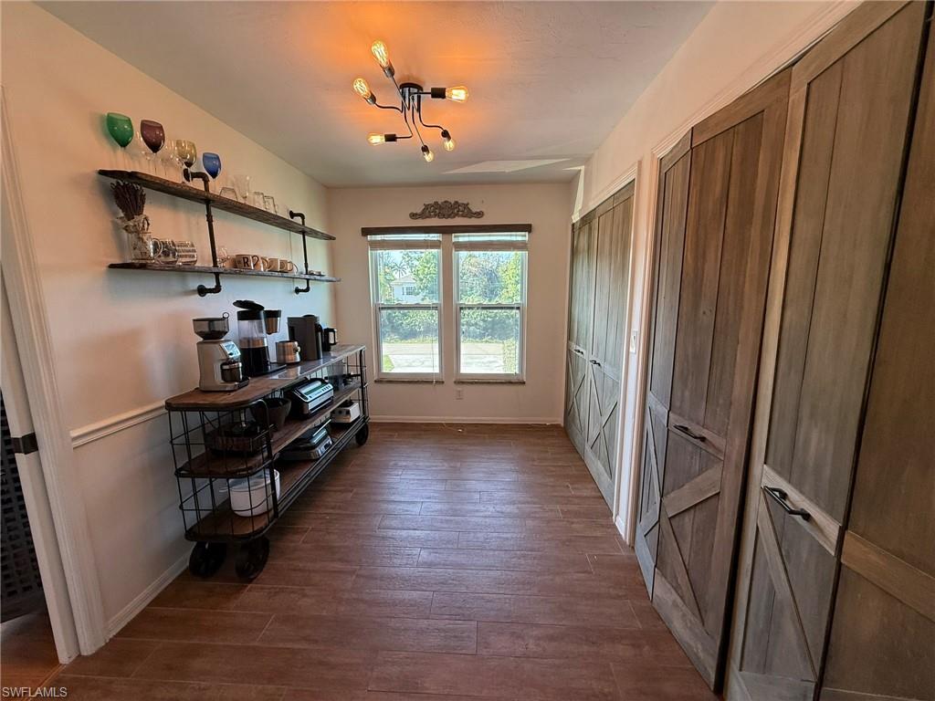 5546 Park Road Fort Myers, FL 33908 - Photo 8 of 33 a kitchen with stainless steel appliances a refrigerator and a window