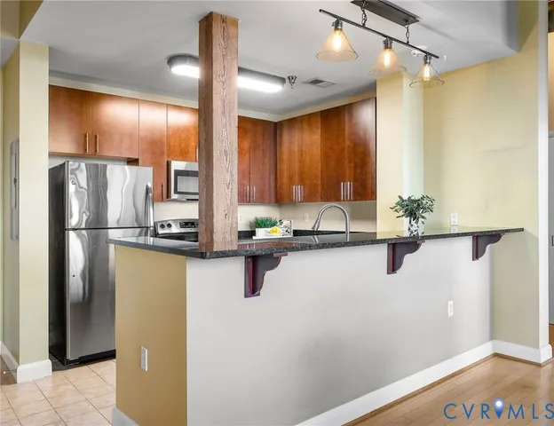 a kitchen with a refrigerator and countertop