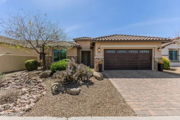 a large kitchen with stainless steel appliances lots of counter space and wooden floor