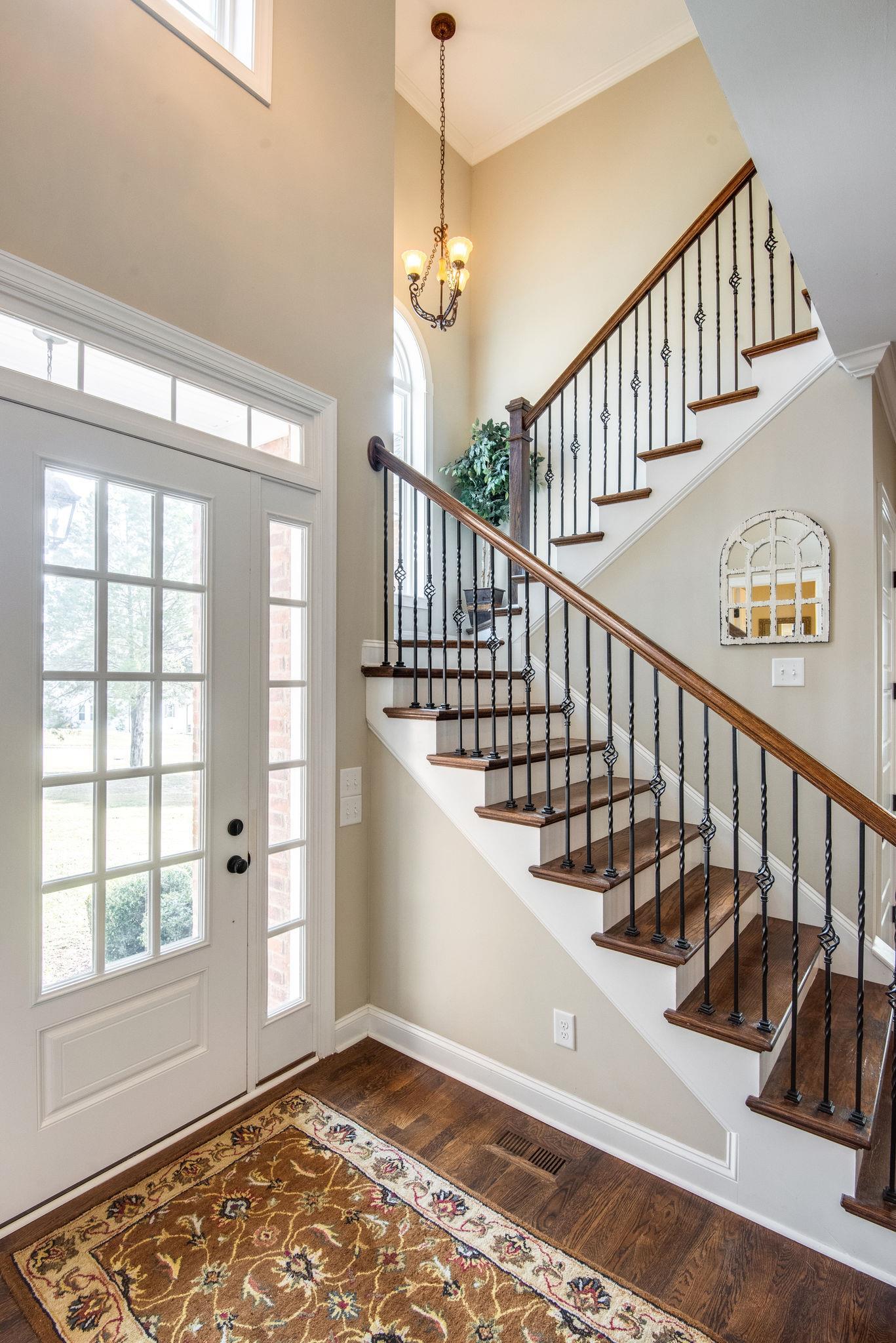 7315 Allans Ridge Lane Fairview, TN 37062 - Photo 5 of 28 Dramatic foyer with iron spindles on the staircase.