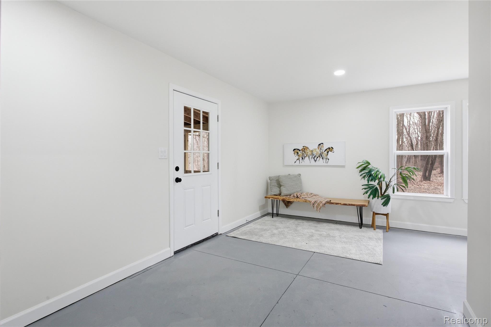 5350 List Road Grass Lake, MI 49240 - Photo 39 of 71 Foyer with finished concrete flooring and recessed lighting