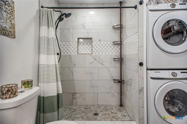 a bathroom with a sink toilet and a shower