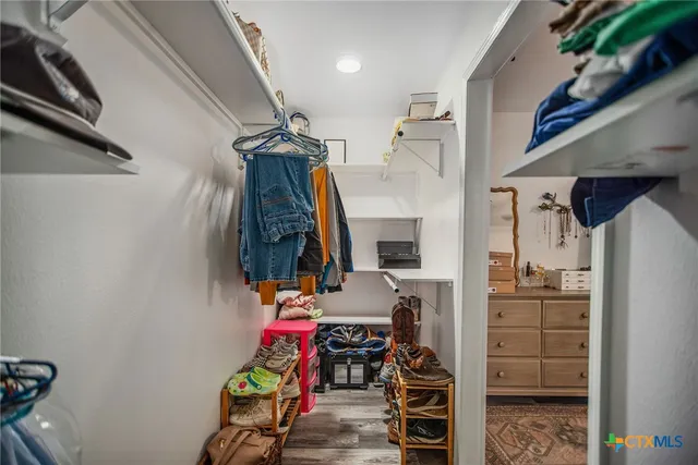 a hallway with painting on the wall