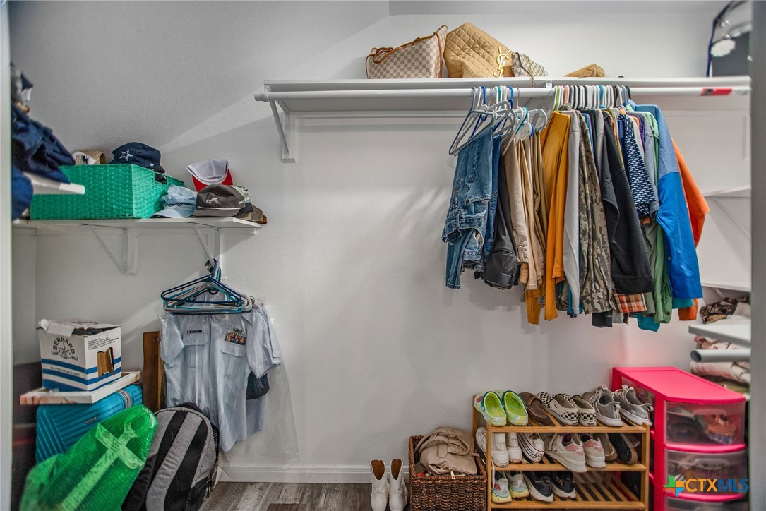 807 Dallas Avenue Seadrift, TX 77983 - Photo 26 of 35 a view of walk in closet with clothes and shoes