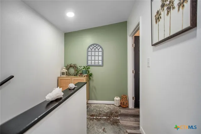 a bedroom with a bed and a table in it