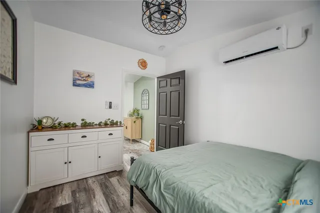 a bathroom with a shower and a sink