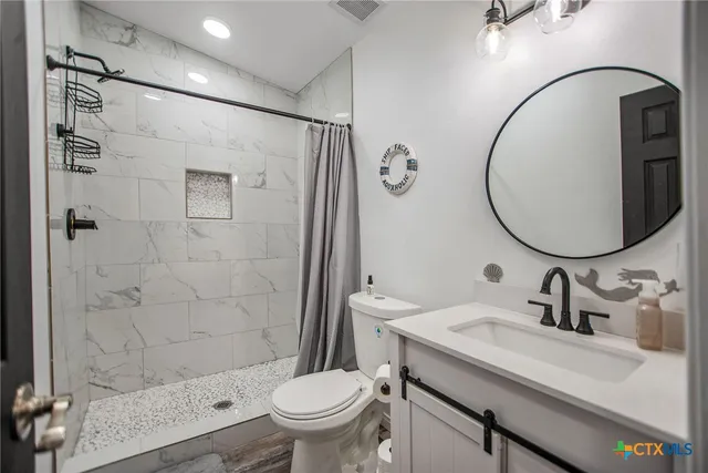 a work room with furniture and a window