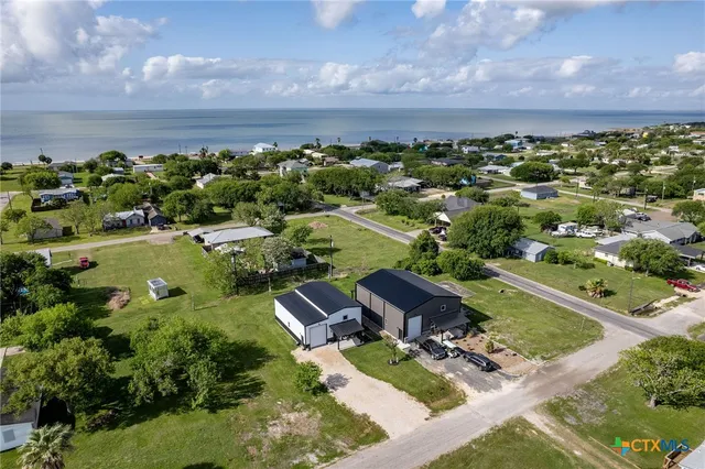 an aerial view of a house with a garden