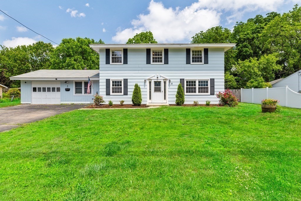 8 Winifred Road Framingham, MA 01701 - Photo 1 of 40 a front view of a house with a yard and trees