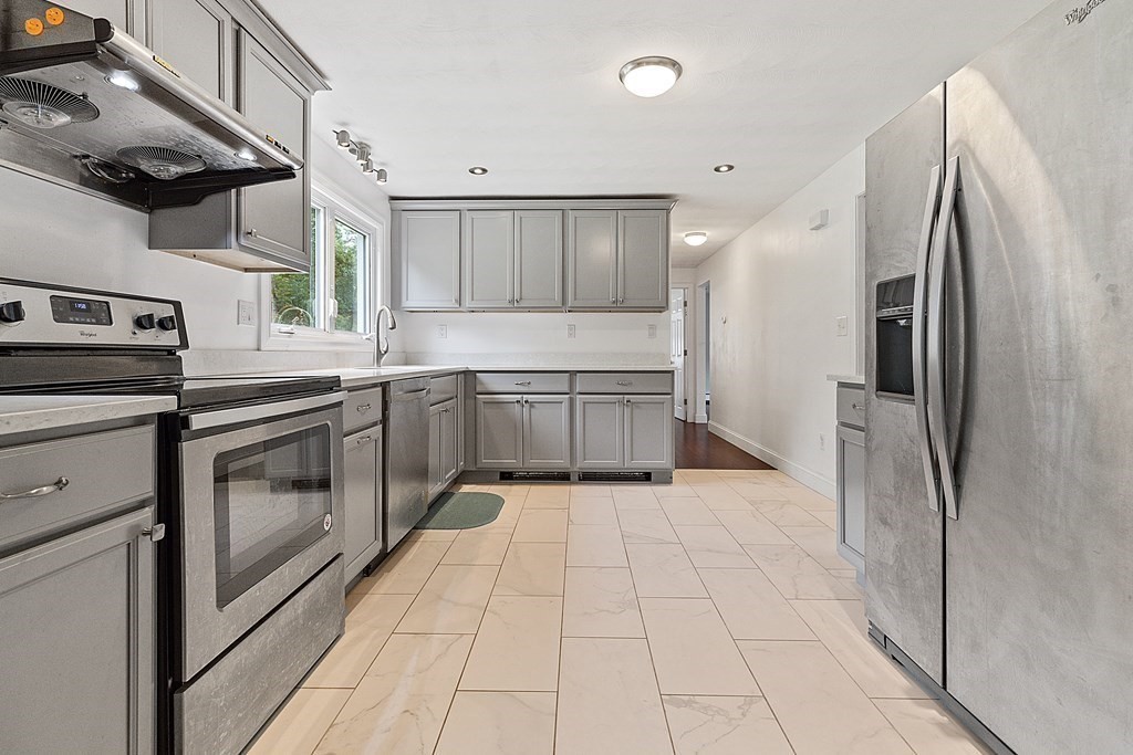 8 Winifred Road Framingham, MA 01701 - Photo 13 of 40 a kitchen with stainless steel appliances granite countertop a refrigerator and a sink