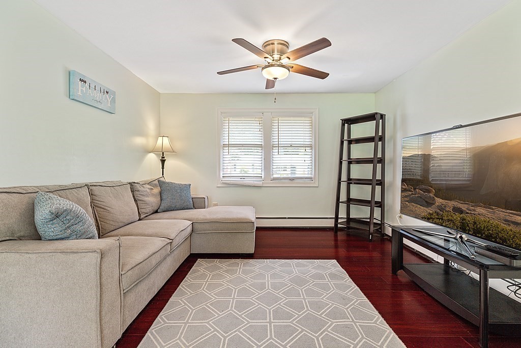 8 Winifred Road Framingham, MA 01701 - Photo 17 of 40 a living room with furniture and a flat screen tv