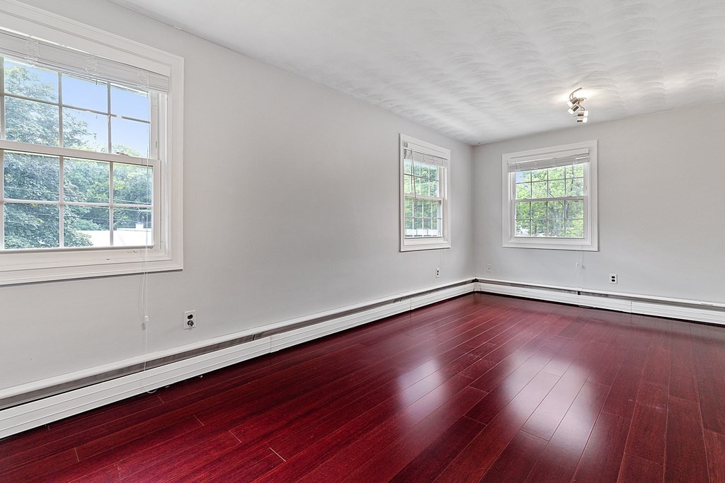 8 Winifred Road Framingham, MA 01701 - Photo 20 of 40 a view of a room with wooden floor and windows in it