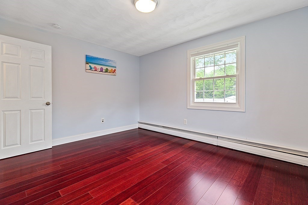8 Winifred Road Framingham, MA 01701 - Photo 21 of 40 an empty room with wooden floor and windows