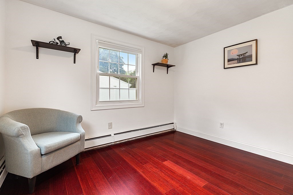 8 Winifred Road Framingham, MA 01701 - Photo 25 of 40 a living room with hard wood floors and a couch