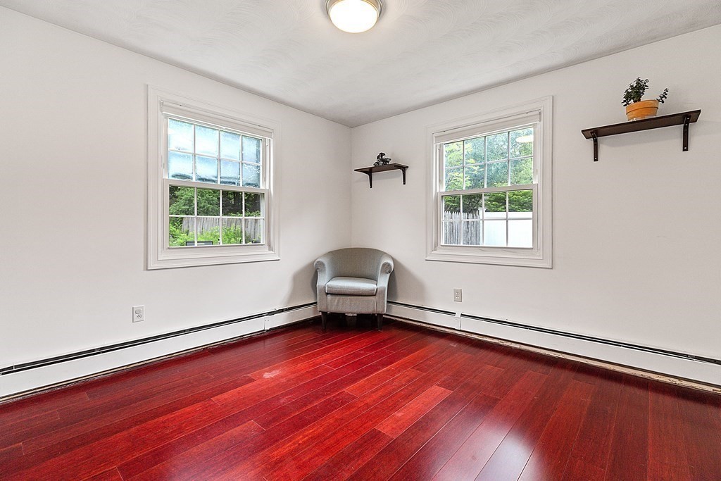 8 Winifred Road Framingham, MA 01701 - Photo 26 of 40 a living room with a wooden floor and a window