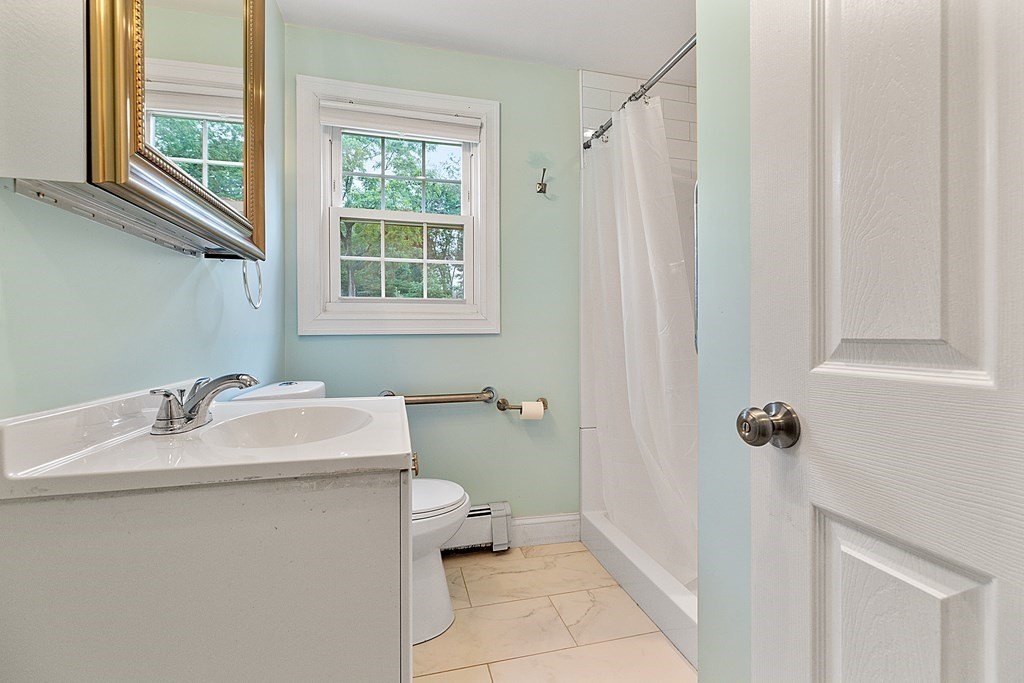 8 Winifred Road Framingham, MA 01701 - Photo 28 of 40 a bathroom with a sink toilet and window