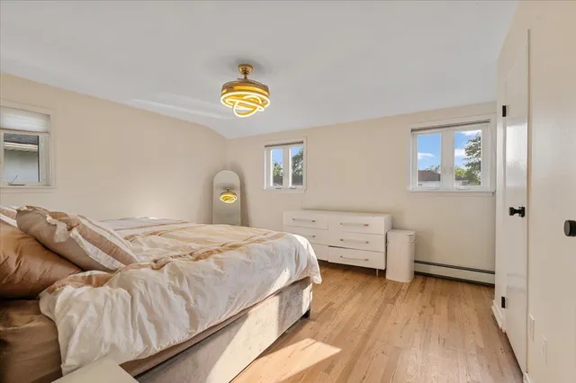 a bedroom with a bed and a desk