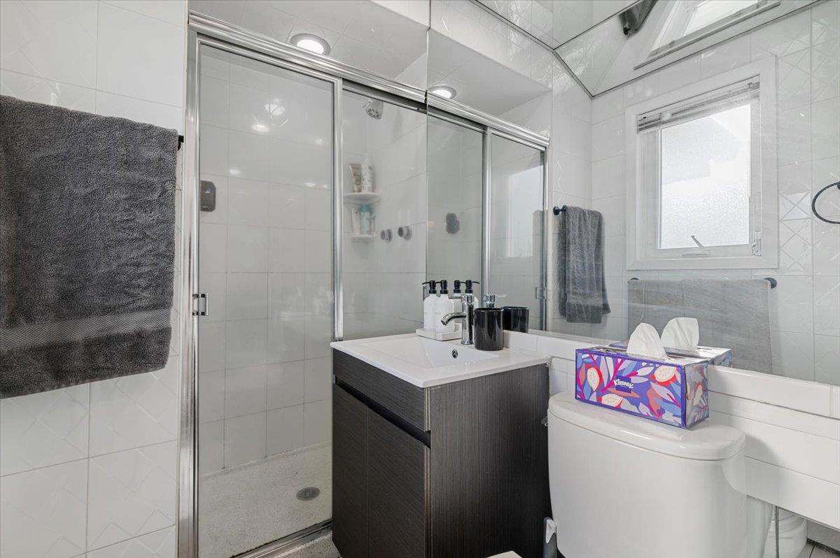 722 Eagle Drive Valley Stream, NY 11581 - Photo 20 of 35 a bathroom with a sink a toilet and shower