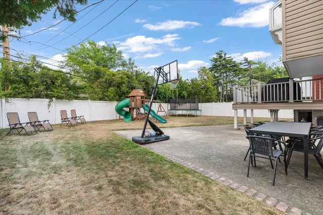 a view of a backyard with a slide