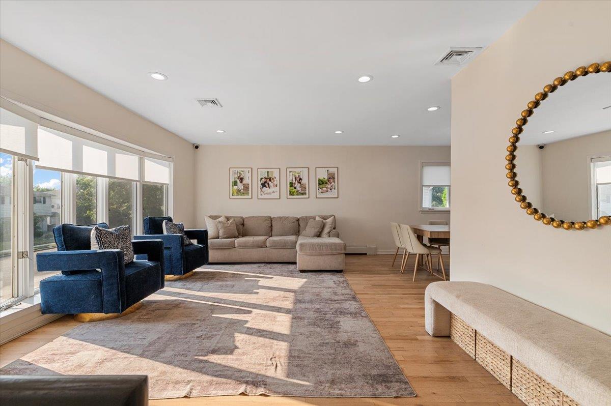 722 Eagle Drive Valley Stream, NY 11581 - Photo 5 of 35 a living room with furniture and a large window
