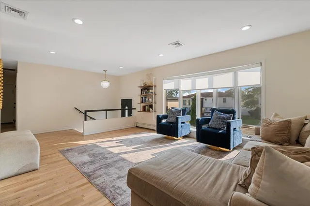 a bedroom with a large bed and a large window