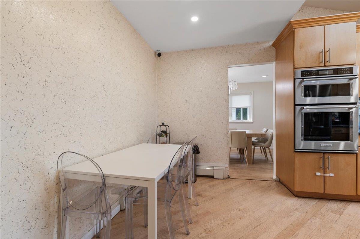 722 Eagle Drive Valley Stream, NY 11581 - Photo 10 of 35 a view of a kitchen with furniture and electronic appliances