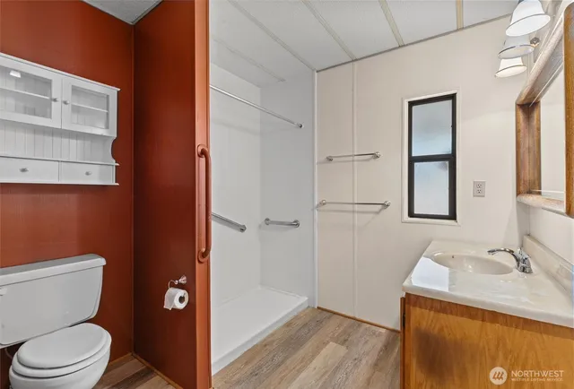 a view of washer and dryer with a kitchen