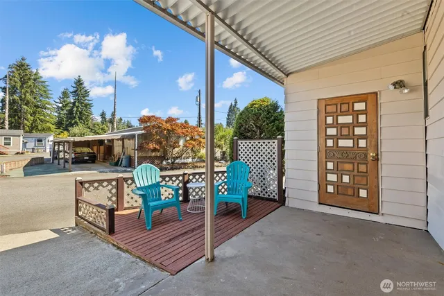 a view of walk in closet with wooden floor and fence