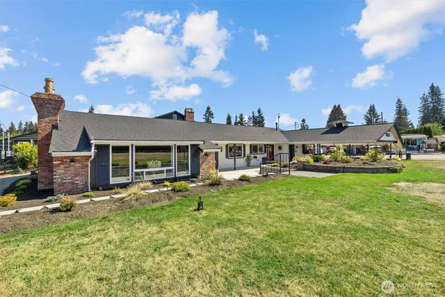 a outdoor space with lots of tables a garden view and chairs