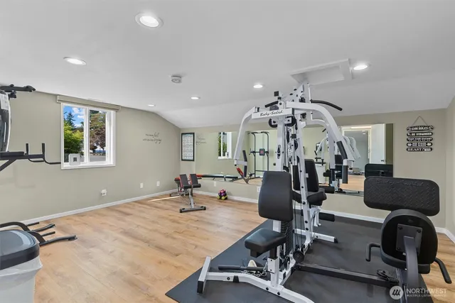a room with pool tables and windows