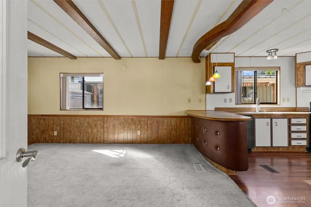 a bathroom with a sink mirror and a bathtub