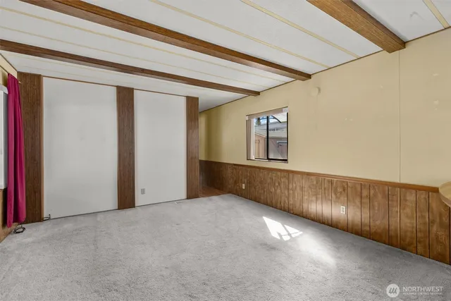 a kitchen with stainless steel appliances granite countertop a stove a sink dishwasher and a refrigerator with wooden floor