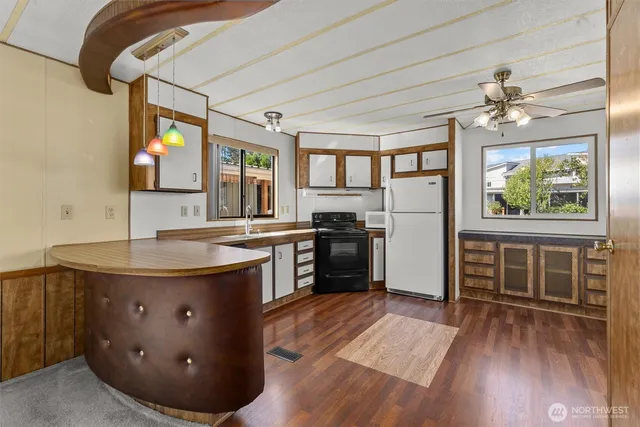 a view of a room with wooden floor and balcony