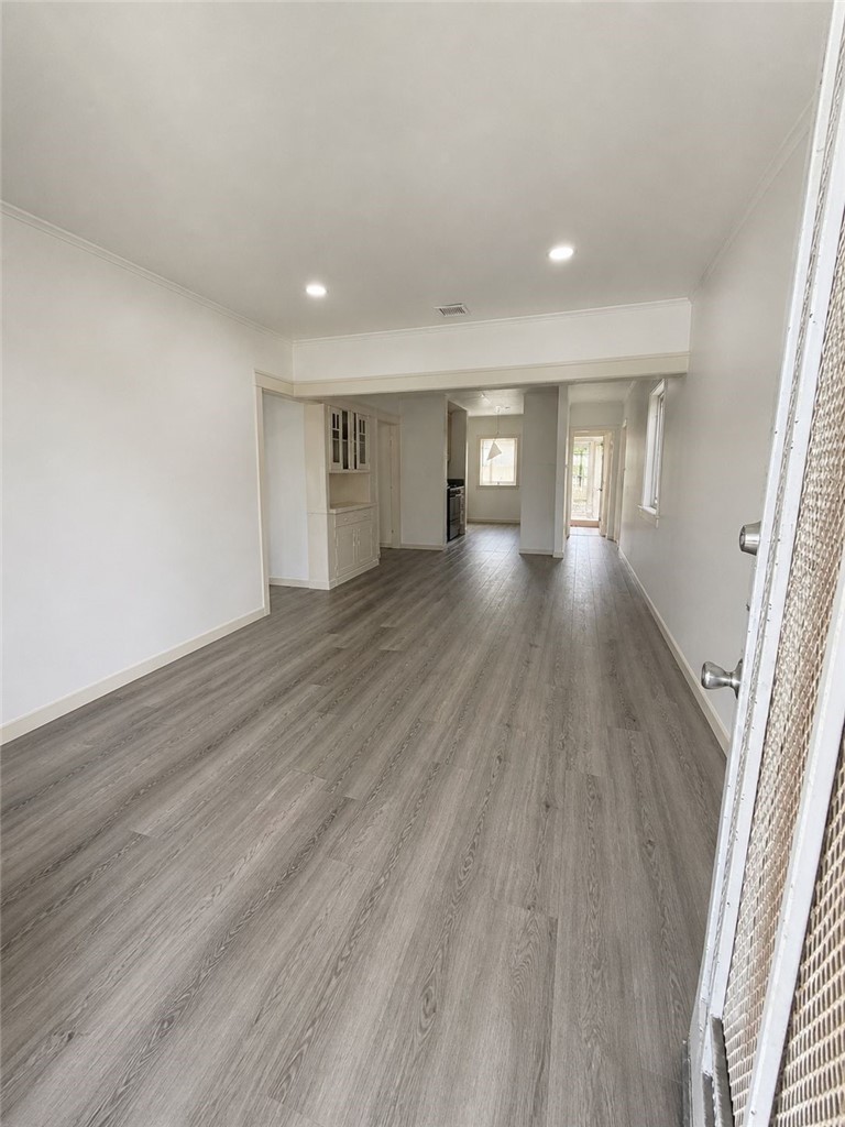 309 Alhambra Road Alhambra, CA 91801 - Photo 4 of 10 wooden floor in an empty room with a window