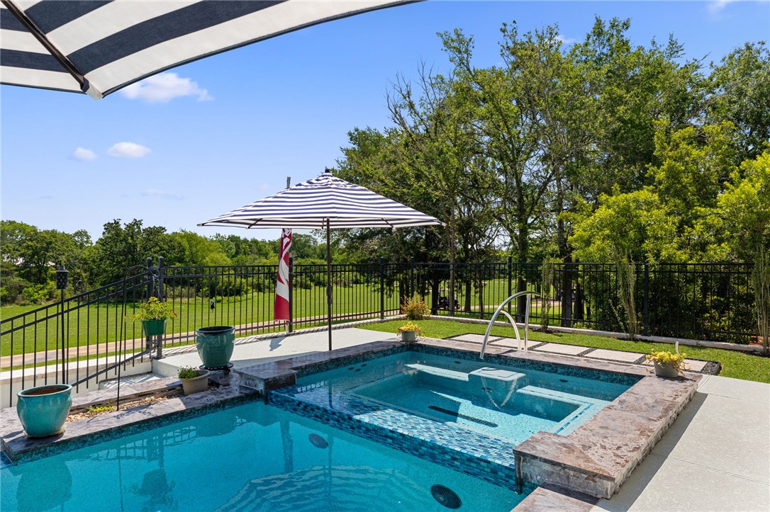 2833 Persimmon Ridge Court Bryan, TX 77807 - Photo 49 of 50 a view of a swimming pool with a patio